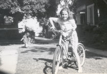 The first picture is me on my bike (with my little sister in the background). Behind me is the Nitzsche's house. Our house is to the left and not in the frame but was identical.